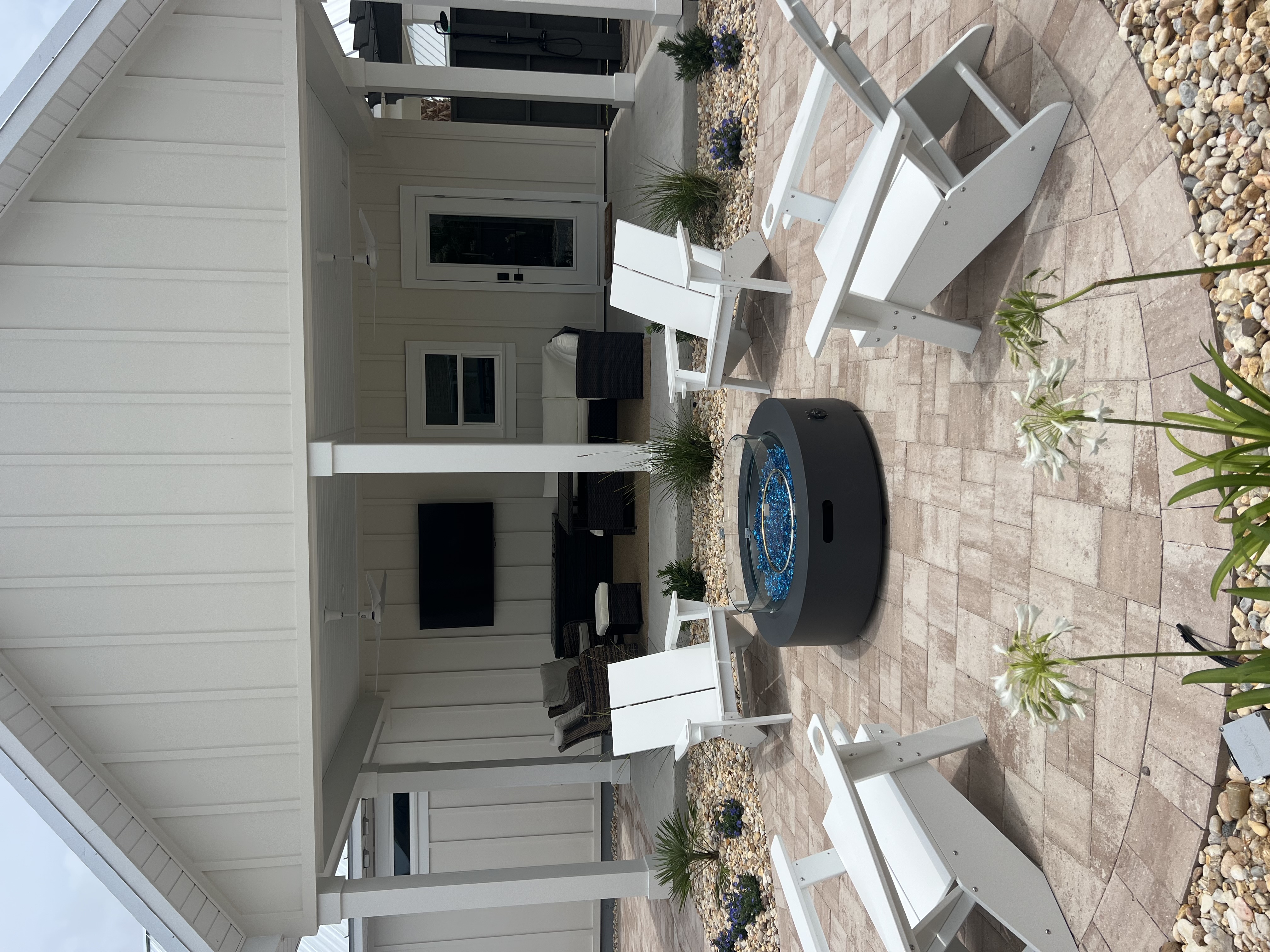 Fire pit patio with Adirondack chairs
