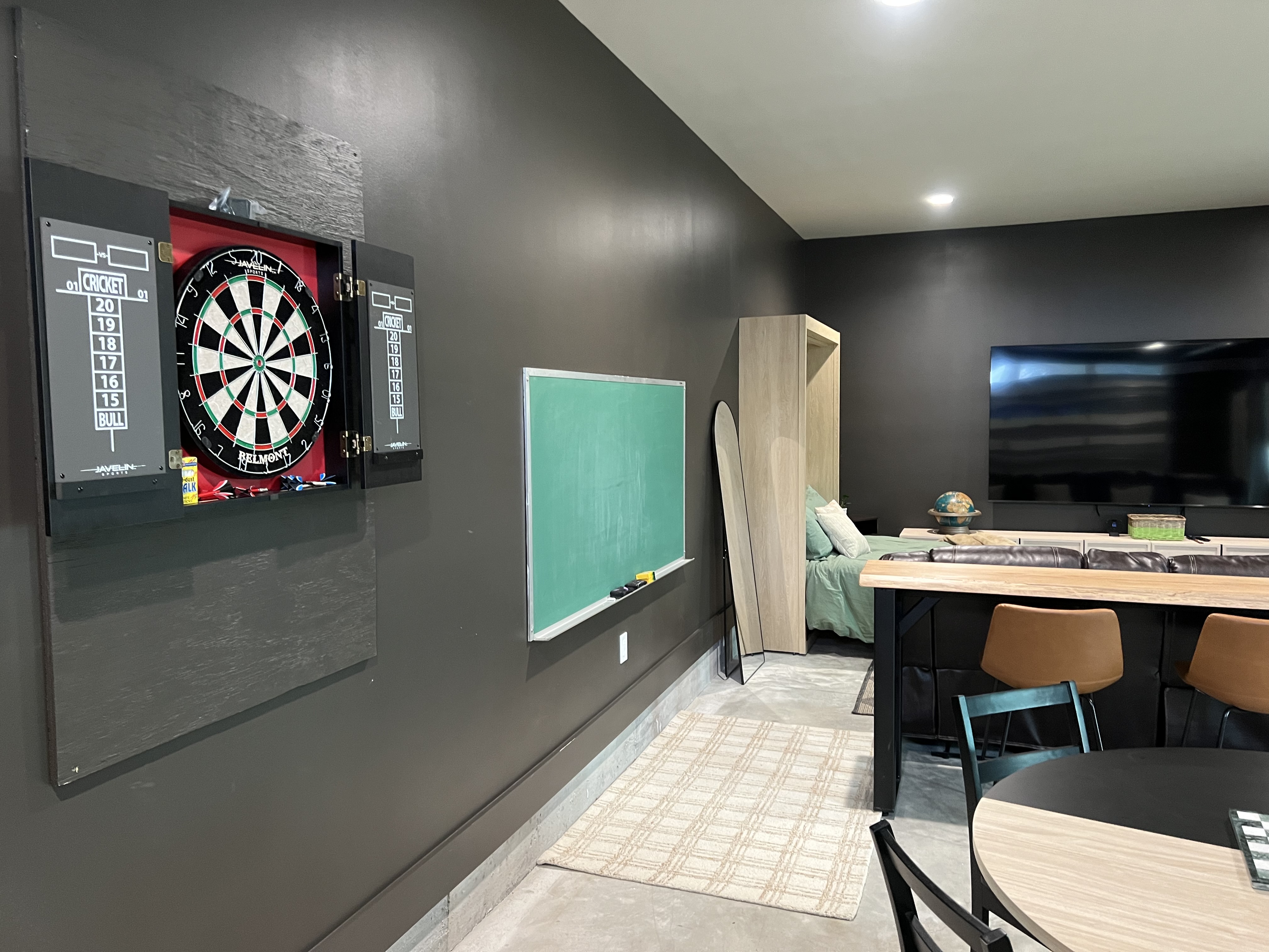Game room dartboard and chalkboard