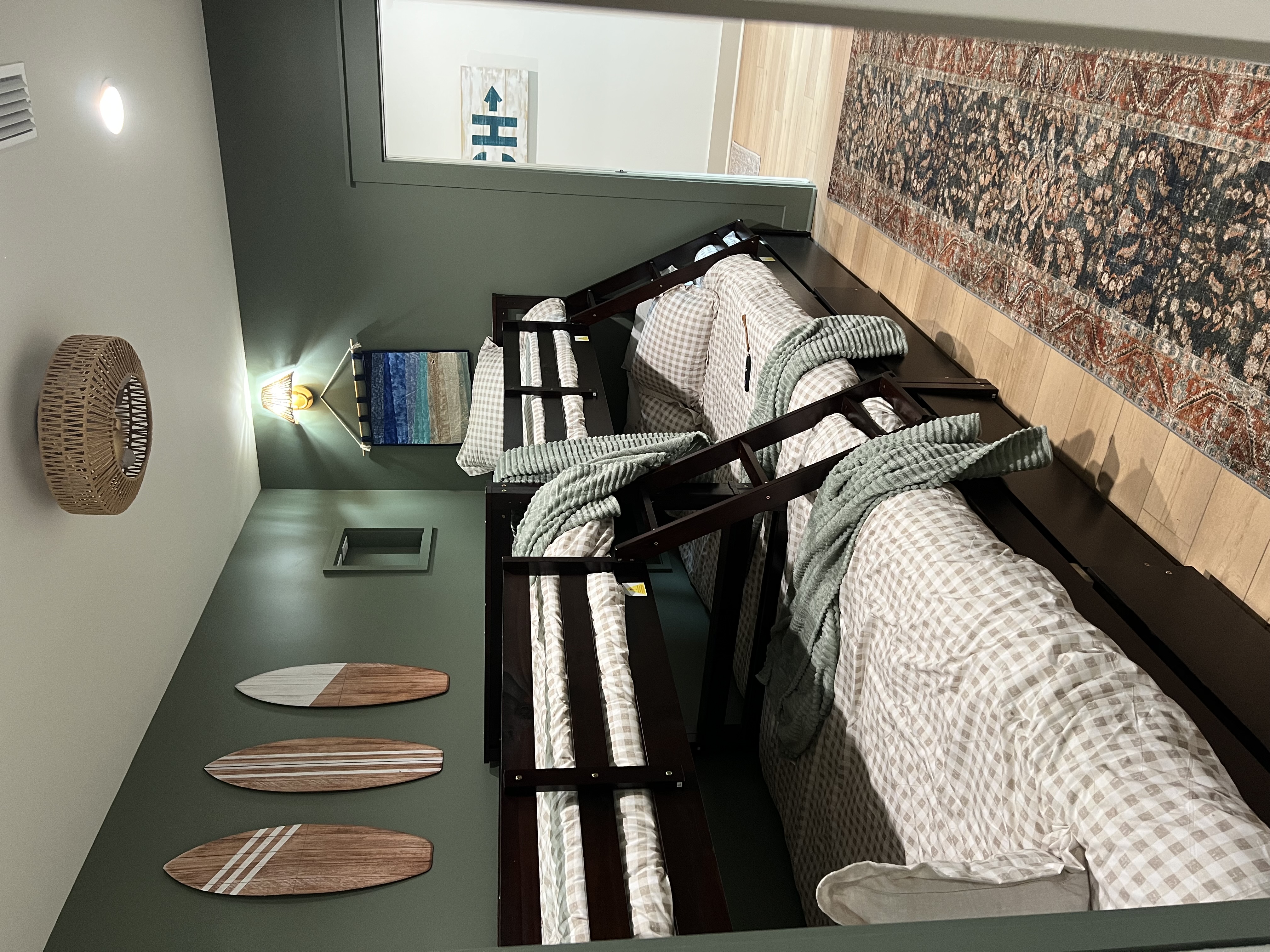 Bunk room with surfboard decor