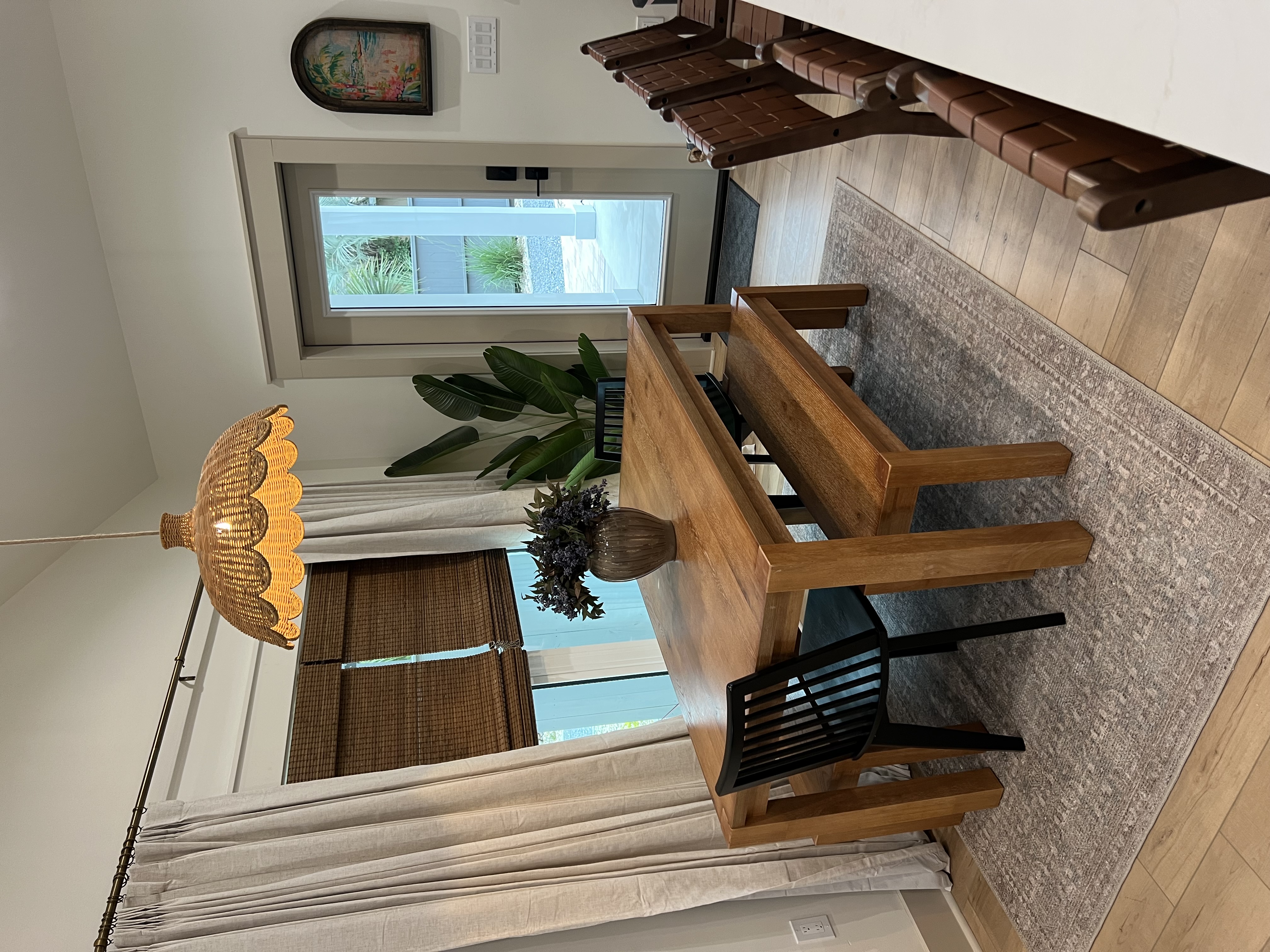 Dining area with wicker pendant light