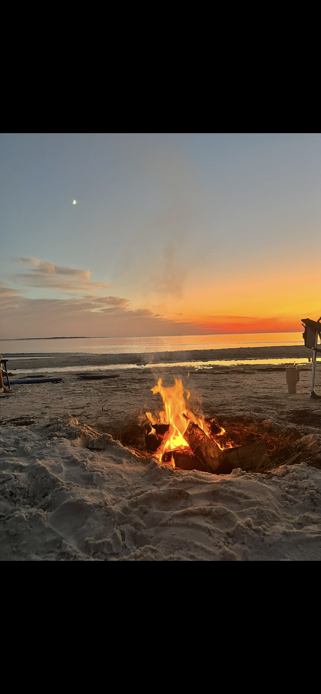 Bonfire on the beach at sunset