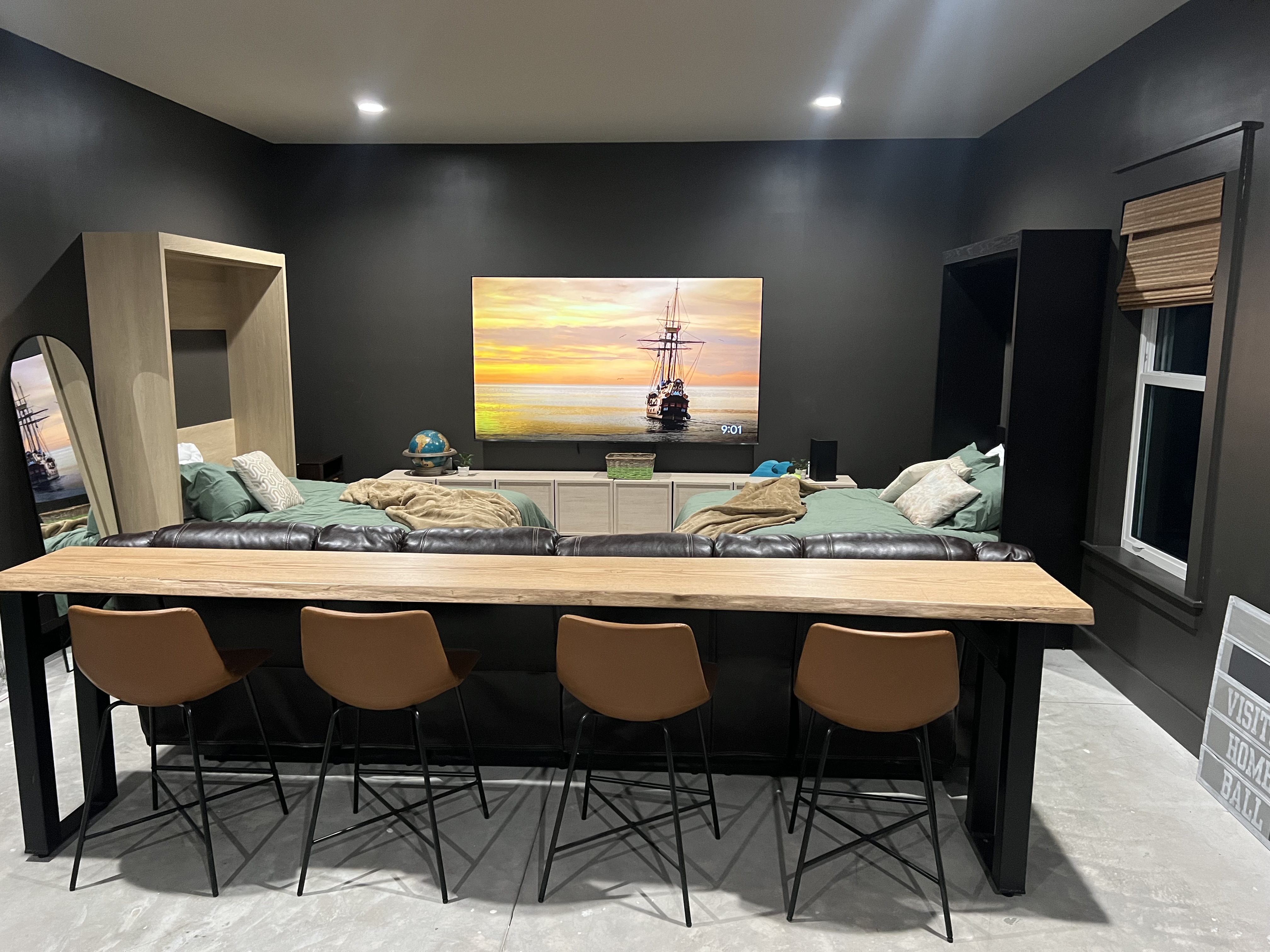 Game room bar table and big-screen TV